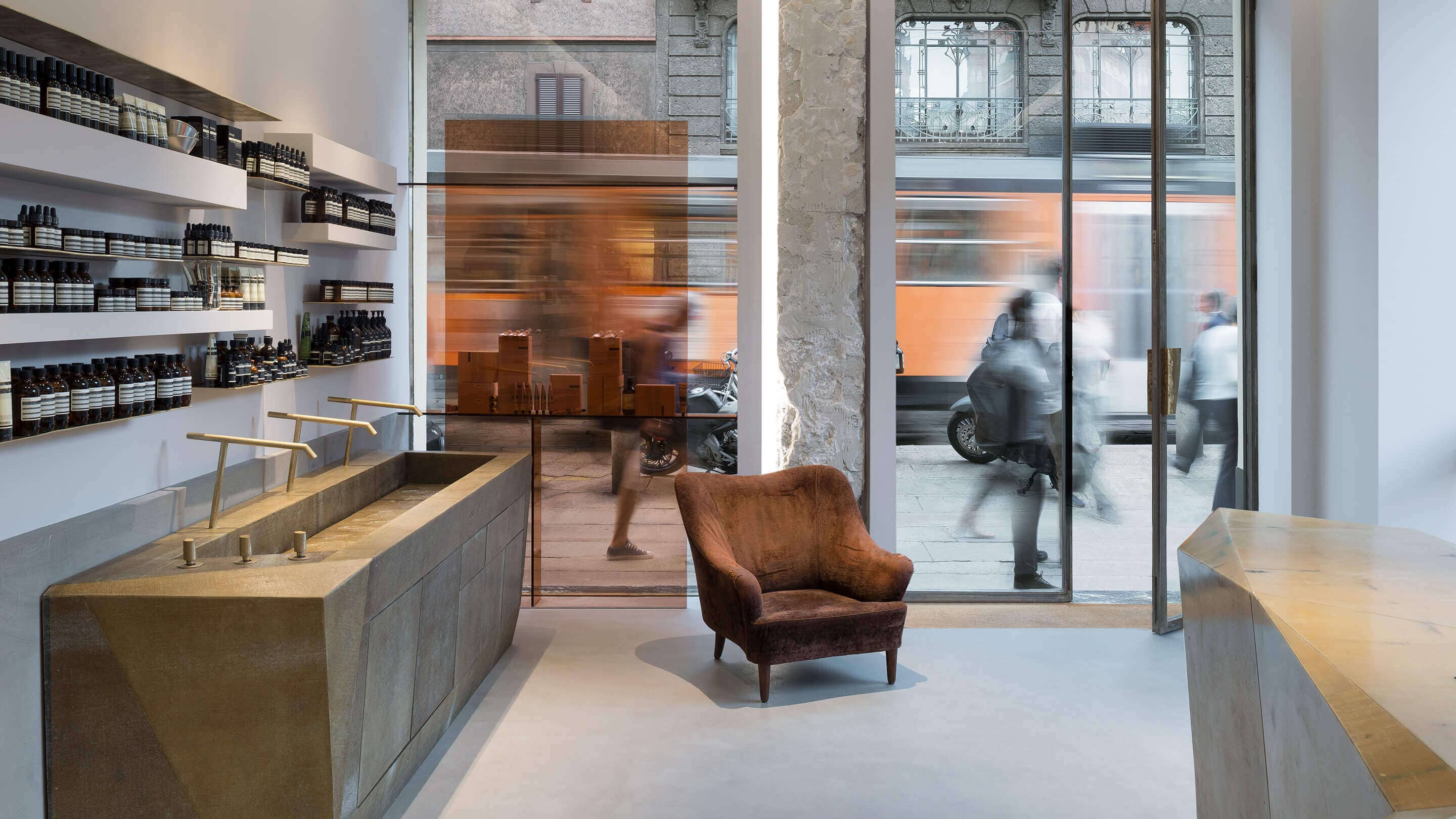 Aesop Brera store interior, looking out onto busy street.