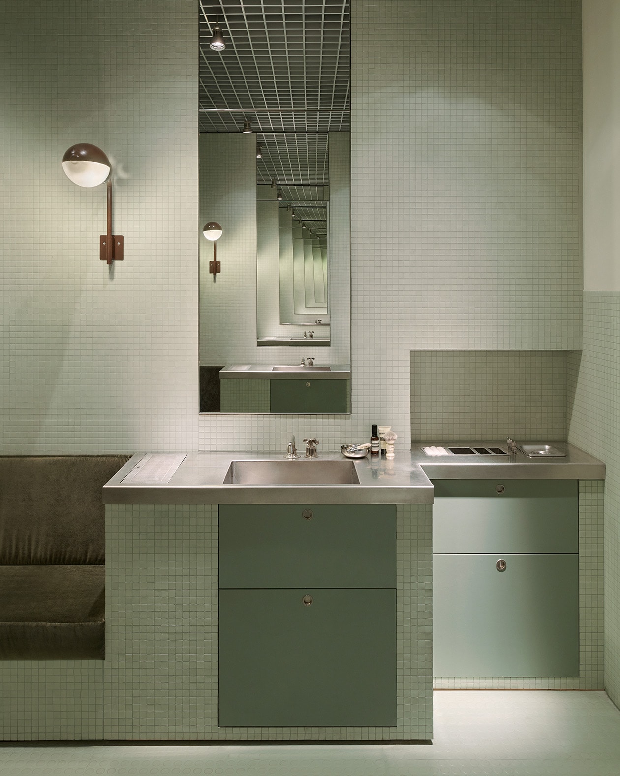 Aesop Milano Cordusio store interior tiled secondary basin and lamp fixture.