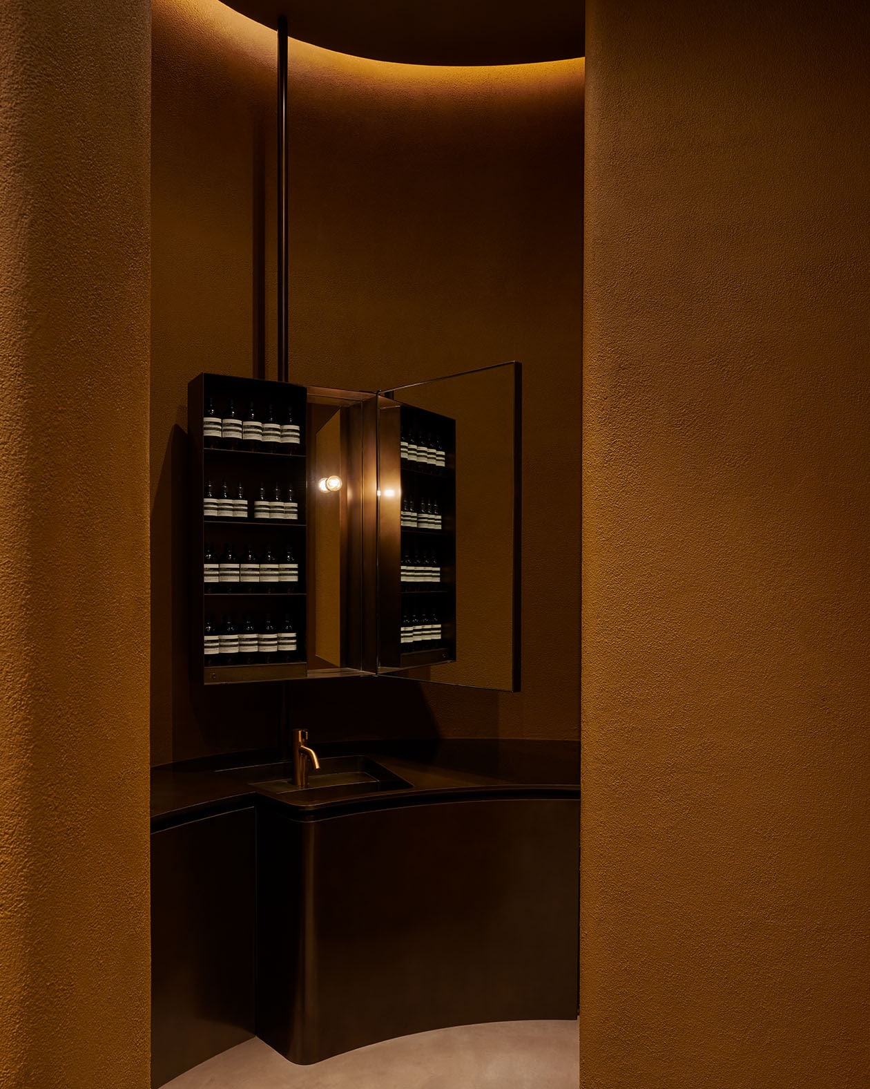 Recessed lighting on the shelves impart a tranquil glow.