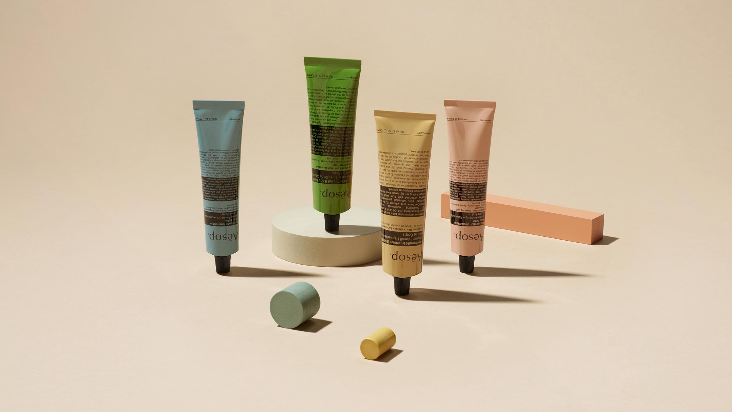 Aesop's body balms, in tubes of different colours