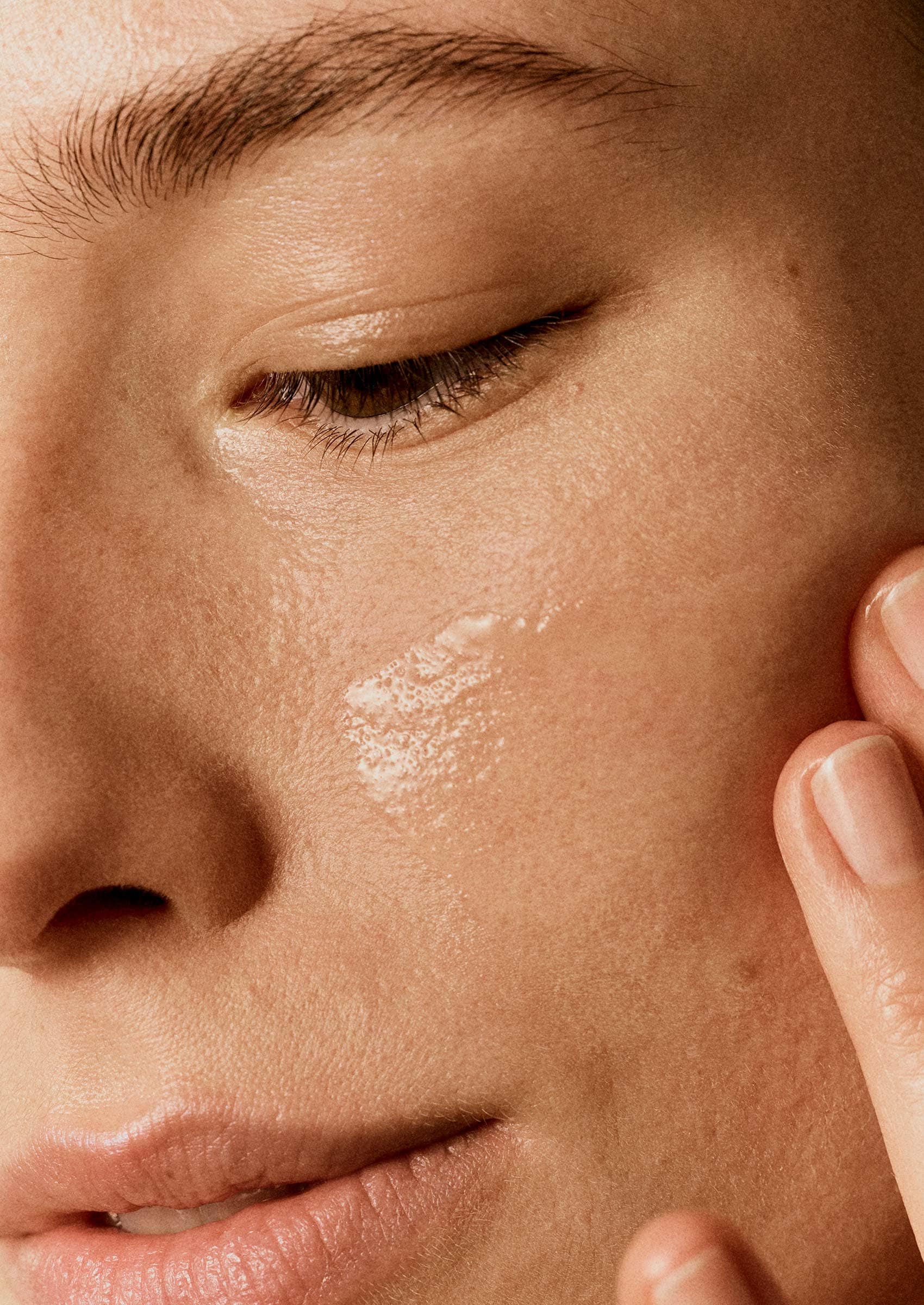Woman holding her face with her hands