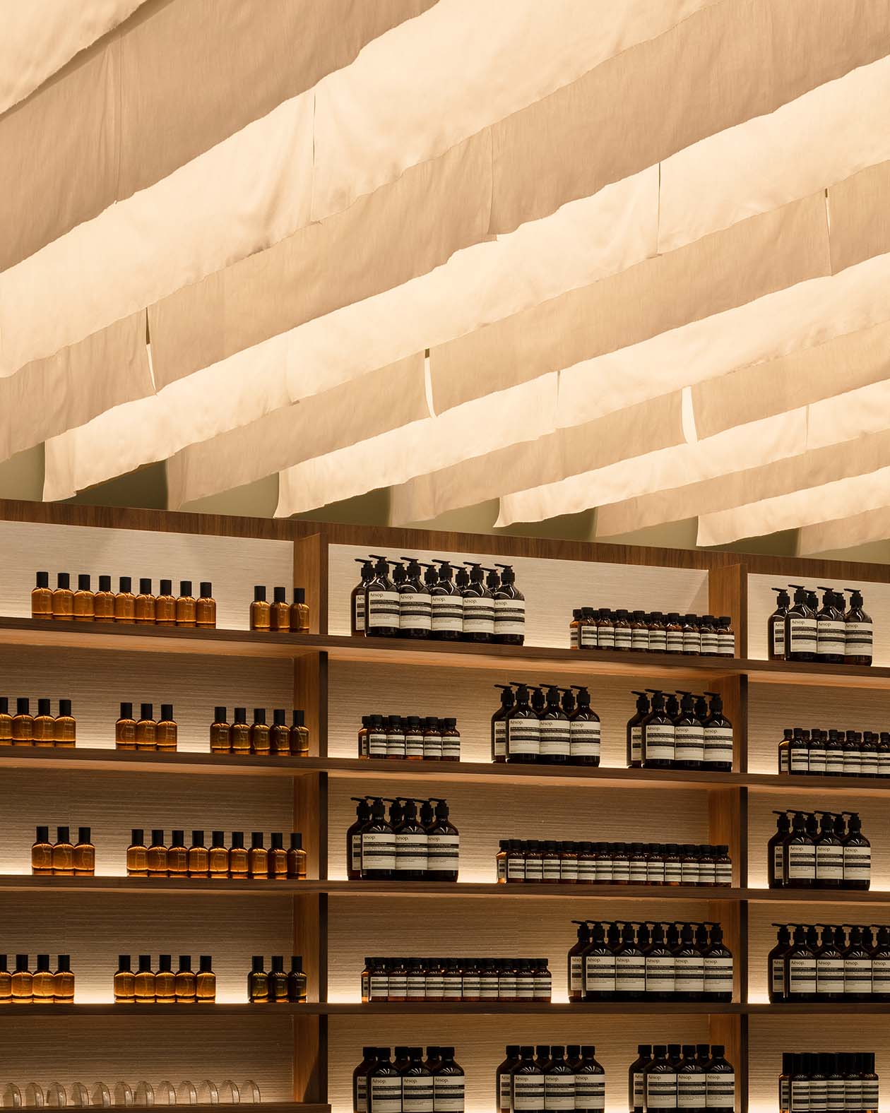Strips of woven cotton are hung from the ceiling in reference to the Tanabata ribbons