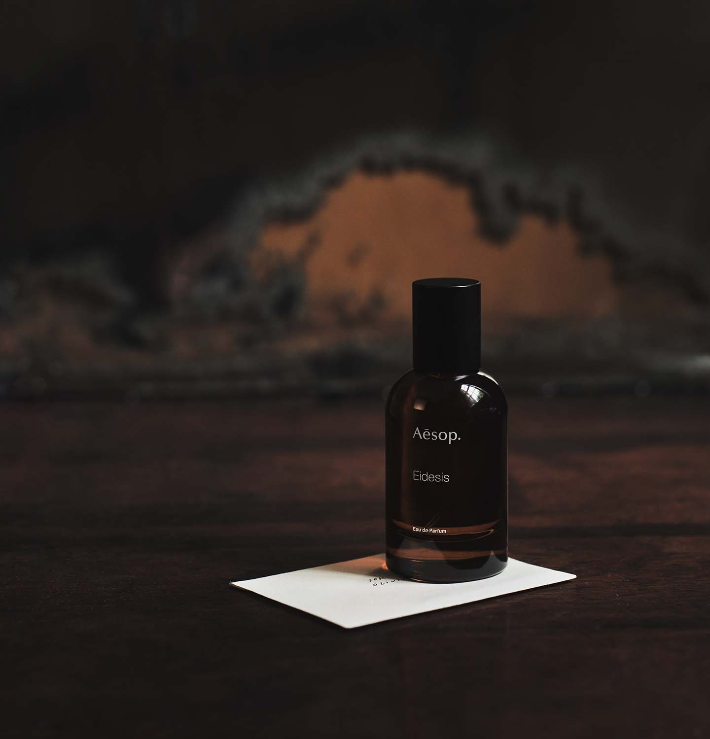 Eidesis Eau de Parfum on a wooden table