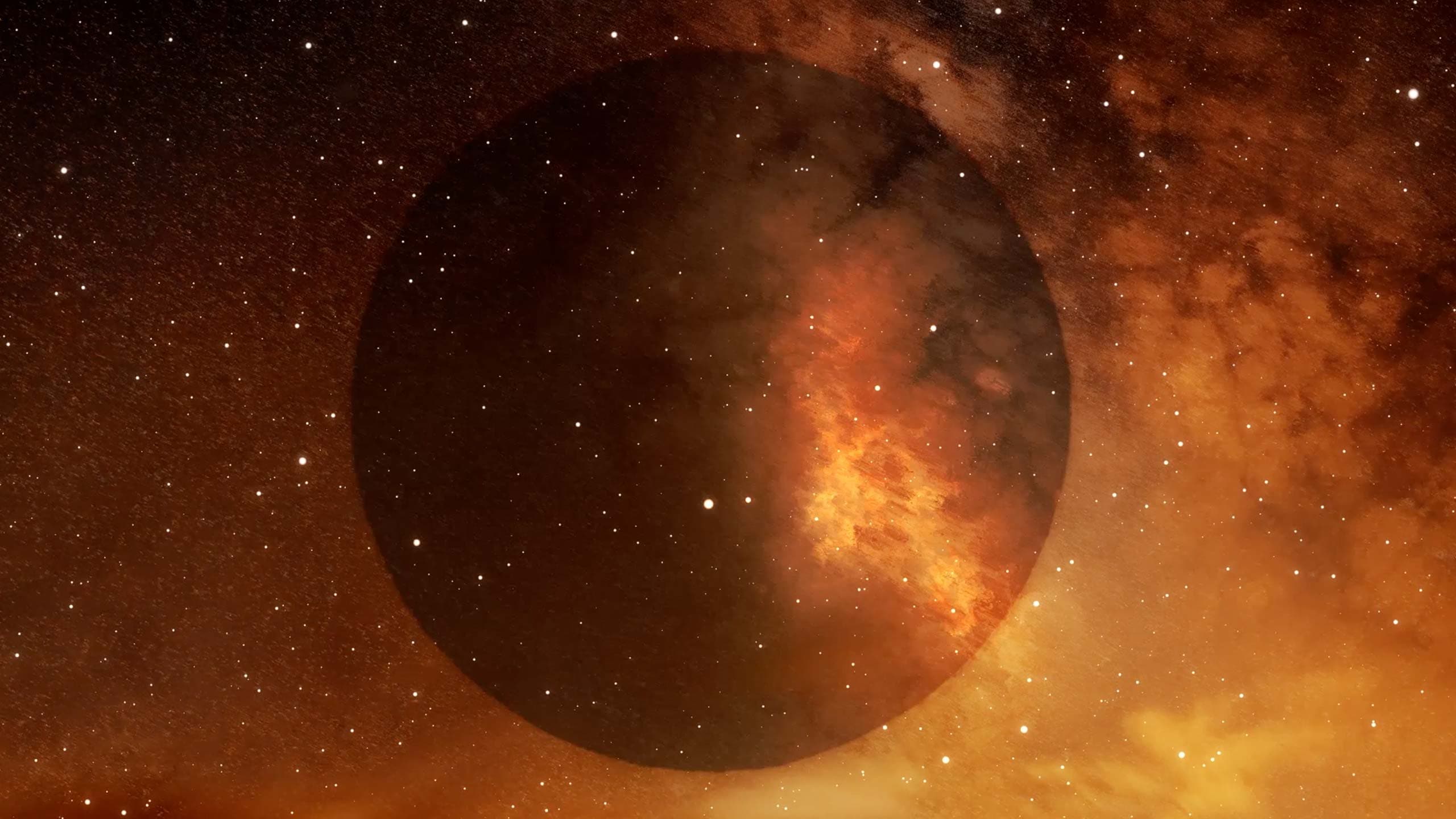 Shadow of a planet or moon in the nights sky with stars.