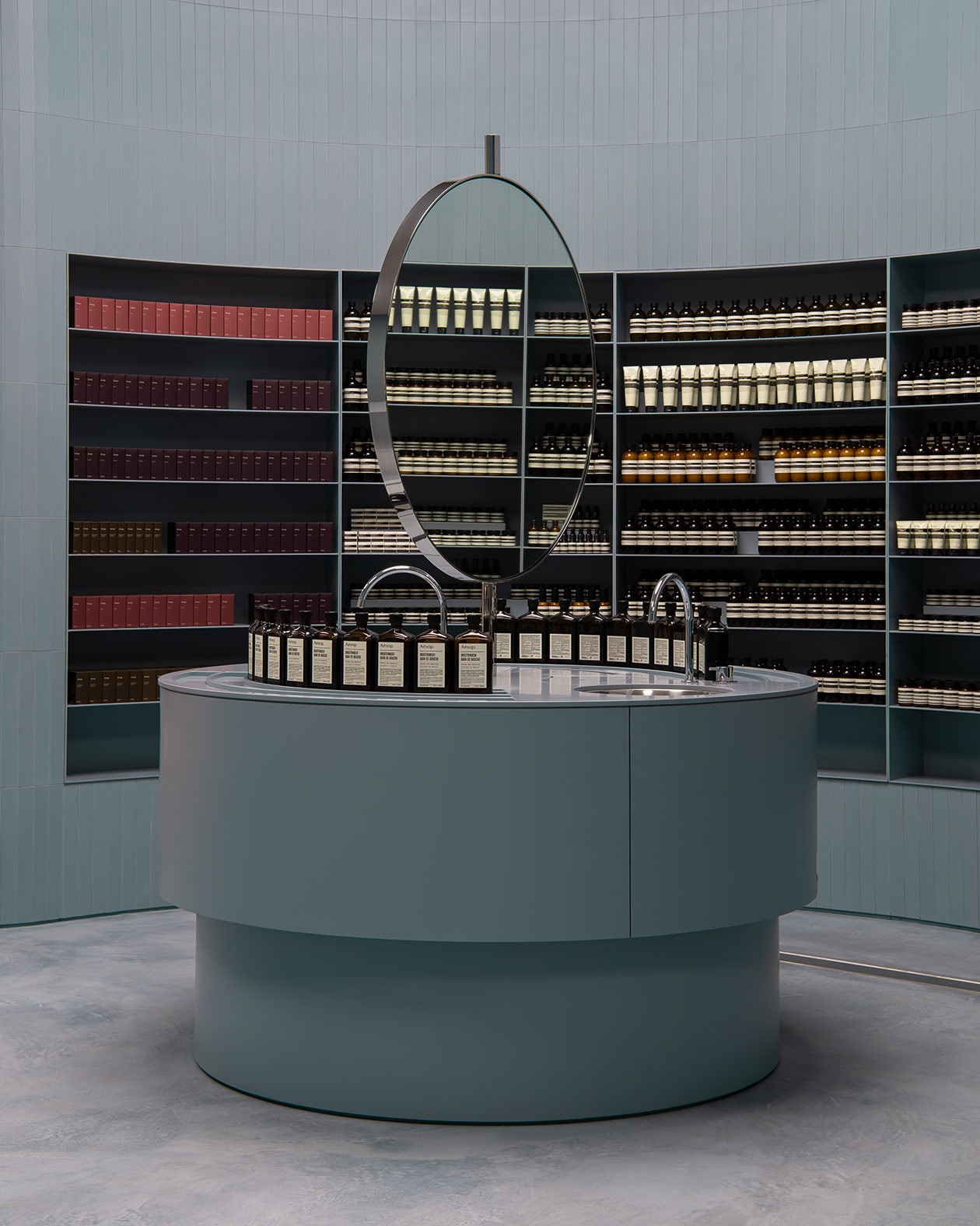 Aesop Karrinyup interior, featuring round blue basin with circular mirror.