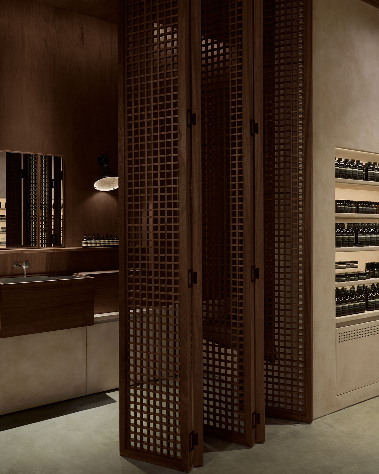 Aesop Central World store is partially covered by wooden blinds that are “semi-open” depending on the angle of view.