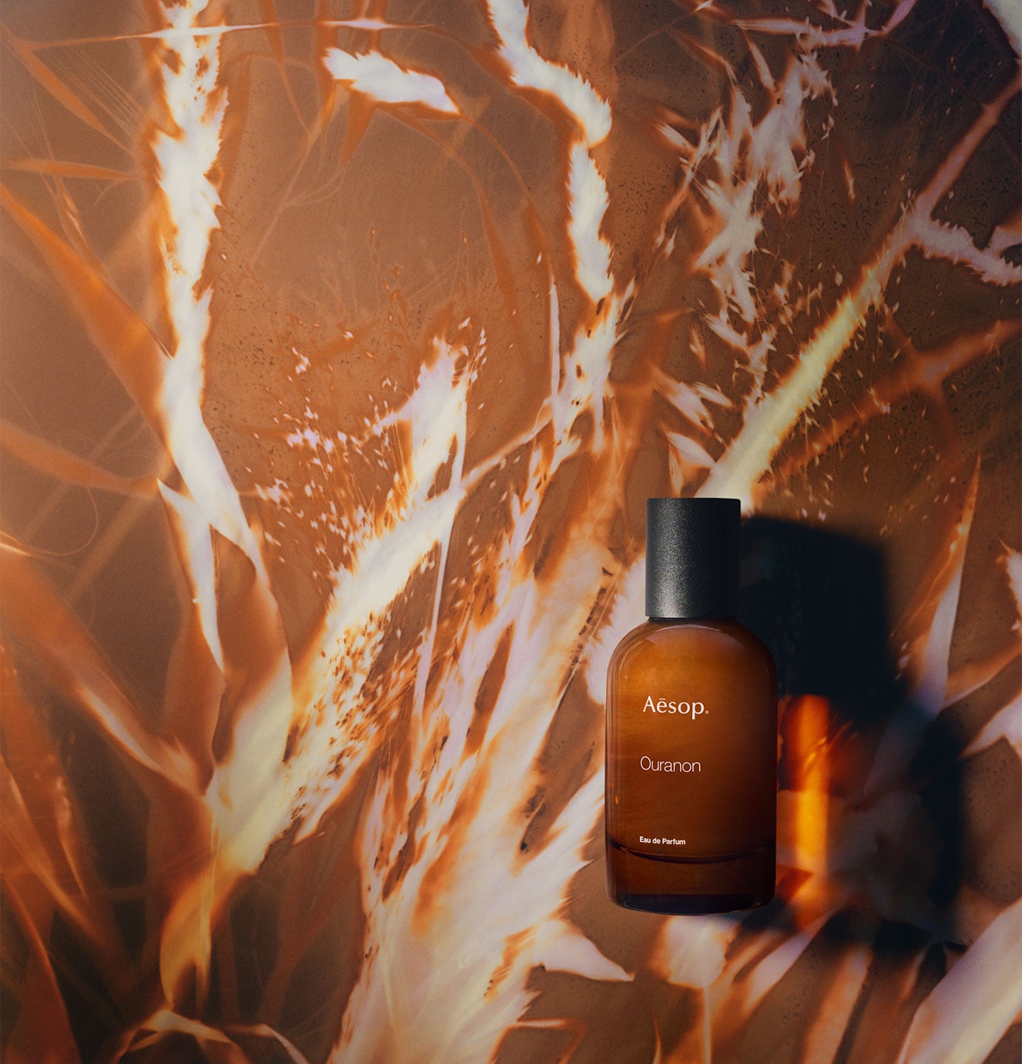 An amber bottle of Ouranon Eau de Parfum