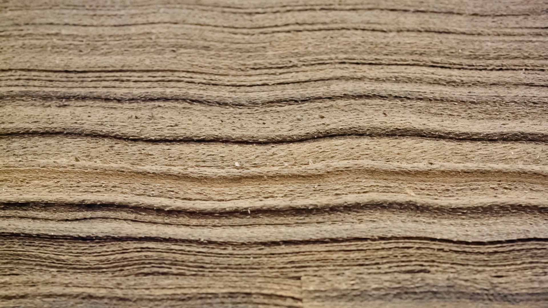 An image of stacked paper material representing the anatomy of the skin.