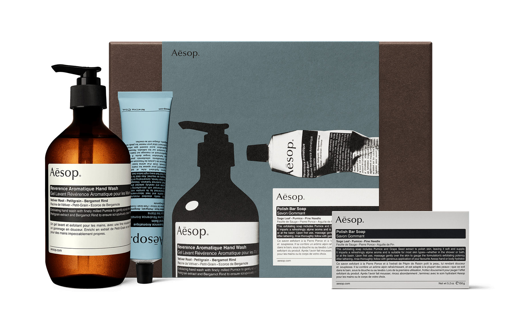 A hand wash, a hand balm and a bar soap alongside a recycled cardboard gift box.