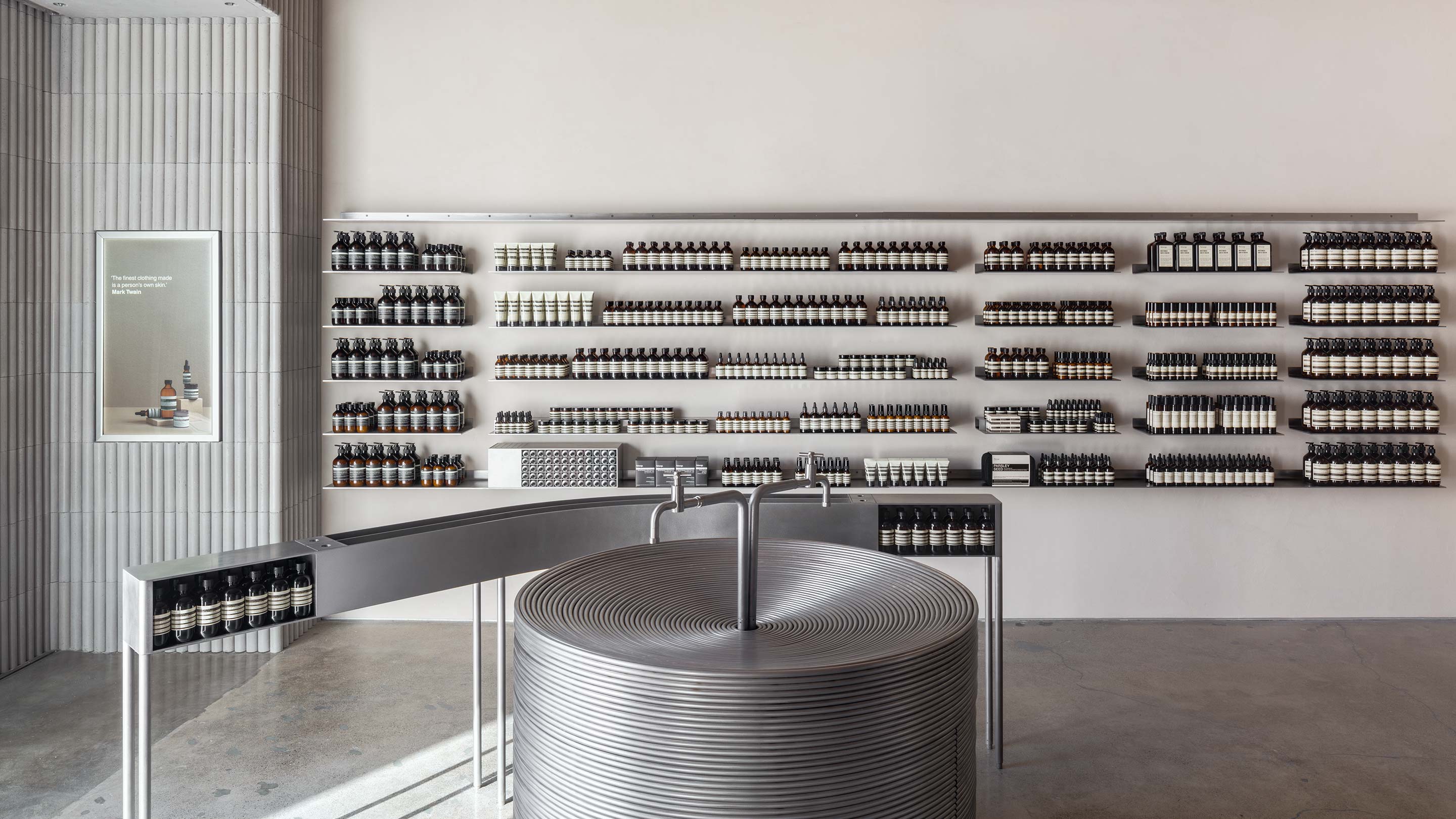 Aesop Corte Madera store, featuring circular sink and products on shelves.